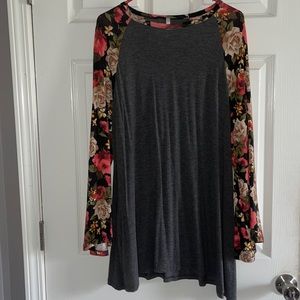 Grey, short dress. Floral sleeves. Could be worn as a long shirt or a dress.